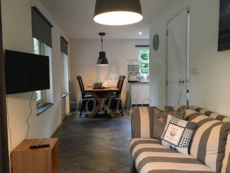 Woonkamer van de recreatiewoning in Oostkapelle 